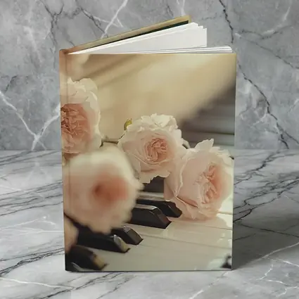 Pink Roses Resting On Piano Keys