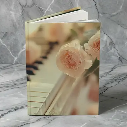 Pink Roses Resting On White Piano Keys