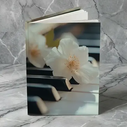 White Flowers Resting On Piano Keys