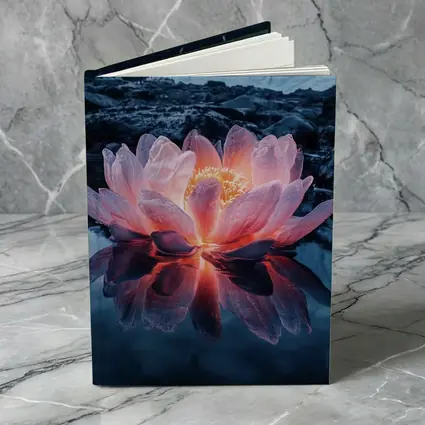 Glowing Lotus Flower on Dark Mountain Lake