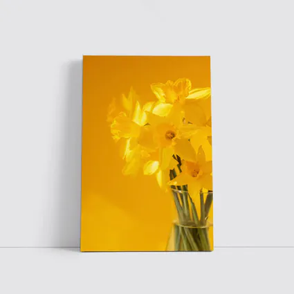 Yellow Daffodils In Glass Vase Golden Background