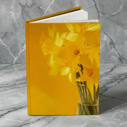 Yellow Daffodils In Glass Vase Golden Background