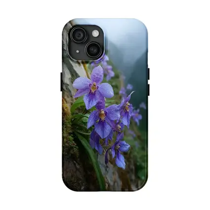 Purple Orchids Growing on Misty Mountain Cliff