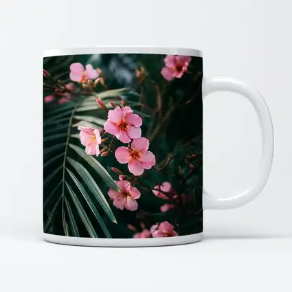 Pink Oleander Flowers Among Green Palm Leaves