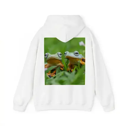 Two Tree Frogs Sitting in Green Grass