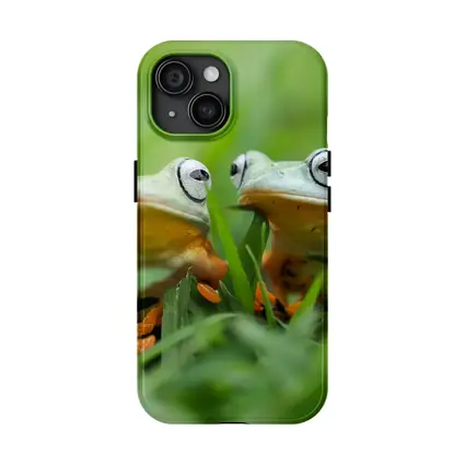 Two Tree Frogs Sitting in Green Grass
