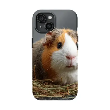 Tricolor Guinea Pig Sitting In Hay