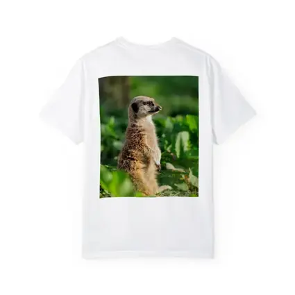 Meerkat Standing Alert In Green Foliage