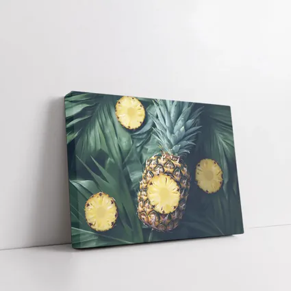 Pineapple Slices On Tropical Palm Leaves