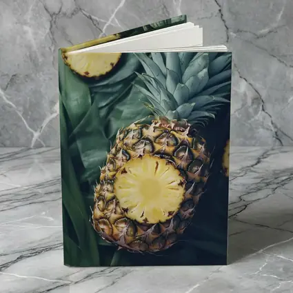 Pineapple Slices On Tropical Palm Leaves