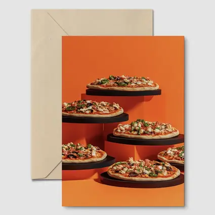 Multiple Pizzas Displayed On Orange Background