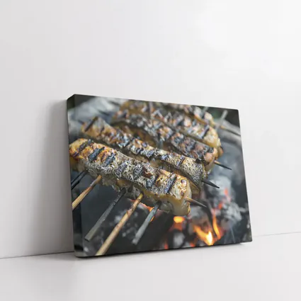 Grilled Fish Skewers Over Open Fire