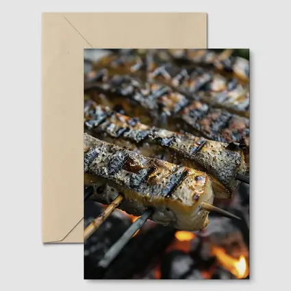 Grilled Fish Skewers Over Open Fire