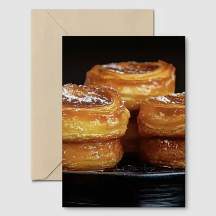 Golden Flaky Pastries On Dark Plate