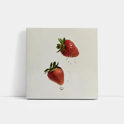 Two Fresh Strawberries Falling With Water Drops