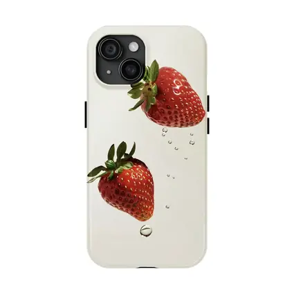 Two Fresh Strawberries Falling With Water Drops