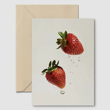 Two Fresh Strawberries Falling With Water Drops