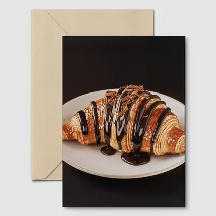 Chocolate Drizzled Croissant On White Plate