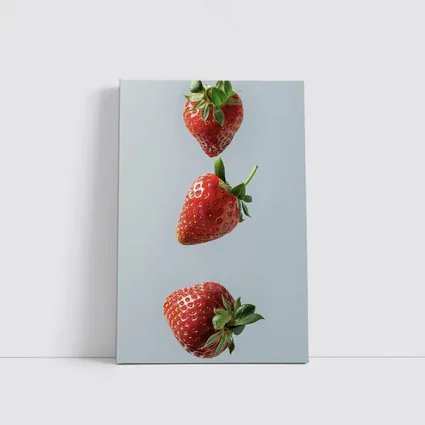 Three Red Strawberries Falling Gray Background