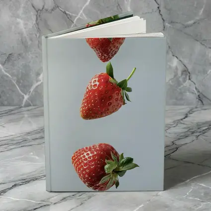 Three Red Strawberries Falling Gray Background