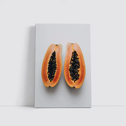 Sliced Papaya Halves on White Background
