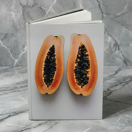Sliced Papaya Halves on White Background