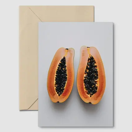 Sliced Papaya Halves on White Background