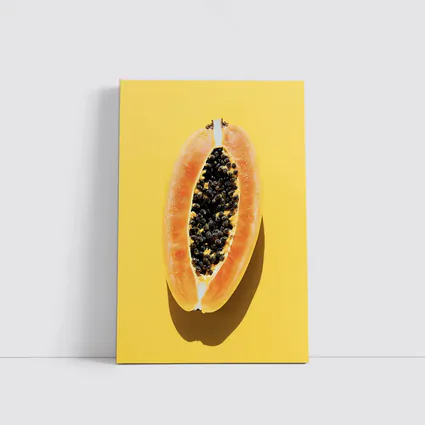 Sliced Papaya On Yellow Background