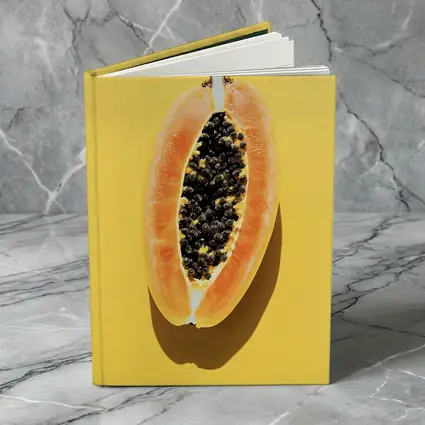Sliced Papaya On Yellow Background