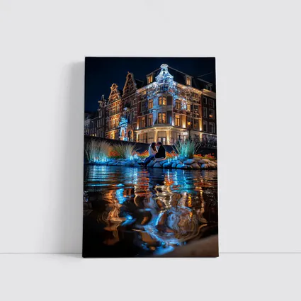 Couple by Amsterdam Canal at Night