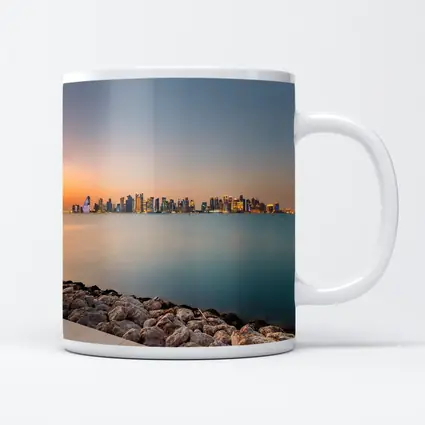Doha Qatar Skyline at Sunset Over Water