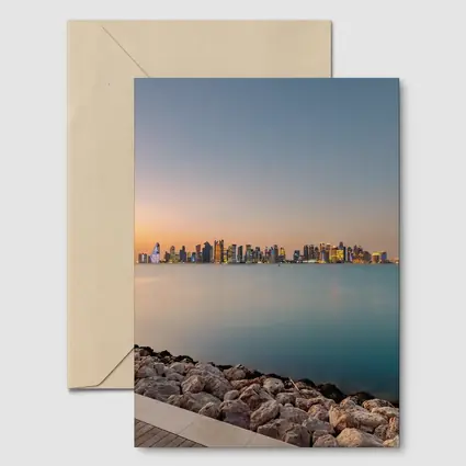 Doha Qatar Skyline at Sunset Over Water