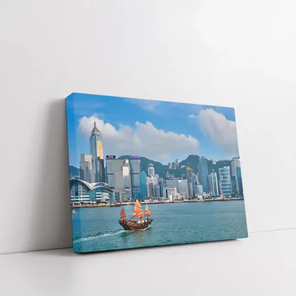 Hong Kong Harbor Skyline with Traditional Junk Boat