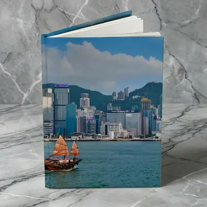 Hong Kong Harbor Skyline with Traditional Junk Boat