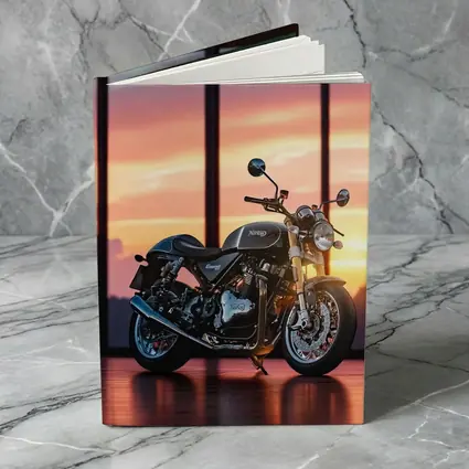 Norton Motorcycle Parked Against Sunset Sky