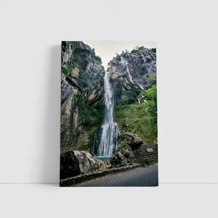 Tall Waterfall Cascading Down Rocky Cliffs