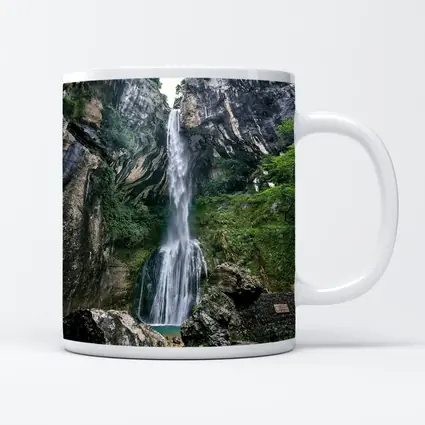 Tall Waterfall Cascading Down Rocky Cliffs