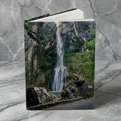 Tall Waterfall Cascading Down Rocky Cliffs