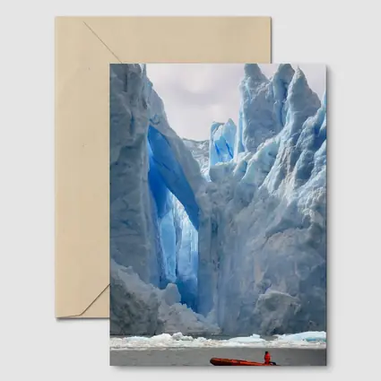 Red Boat Near Massive Blue Glacier Wall