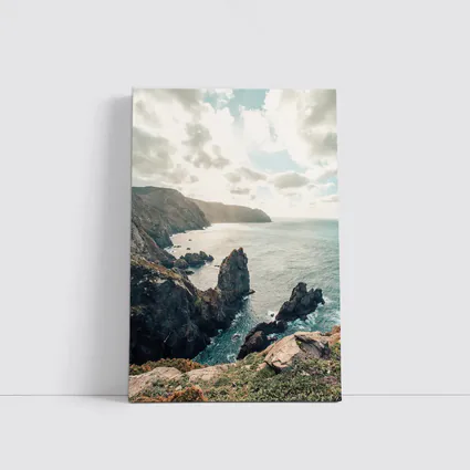 Rocky Coastal Cliffs Over Blue Ocean
