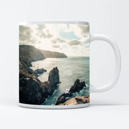 Rocky Coastal Cliffs Over Blue Ocean