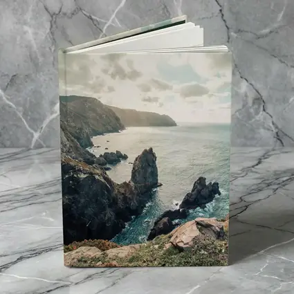 Rocky Coastal Cliffs Over Blue Ocean