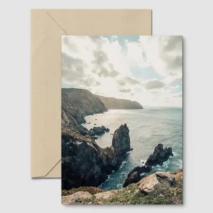 Rocky Coastal Cliffs Over Blue Ocean