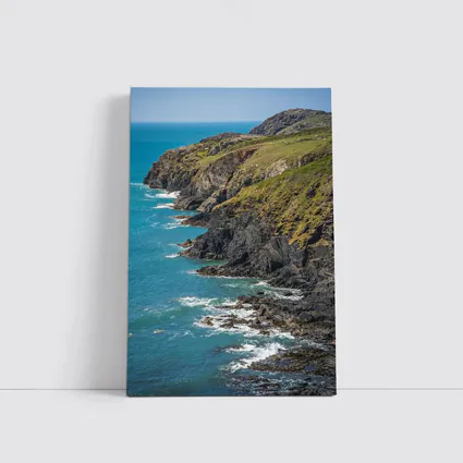Rocky Coastal Cliffs Above Turquoise Ocean Waves
