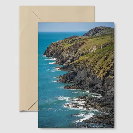 Rocky Coastal Cliffs Above Turquoise Ocean Waves