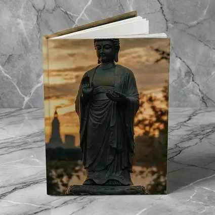 Bronze Buddha Statue Glowing Sunset City