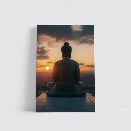 Buddha Statue Meditating Against Sunset Cityscape