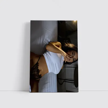 Sensual Woman Reclining On White Bed