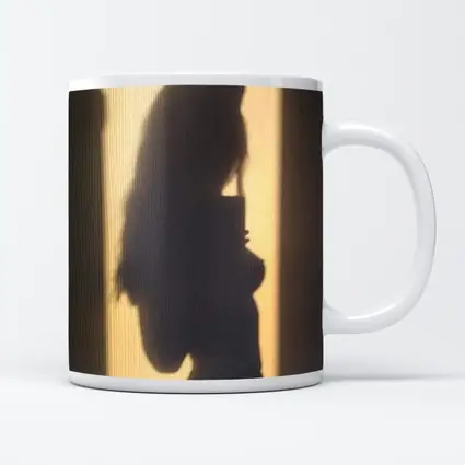 Woman Silhouette Shadow On Beige Wall