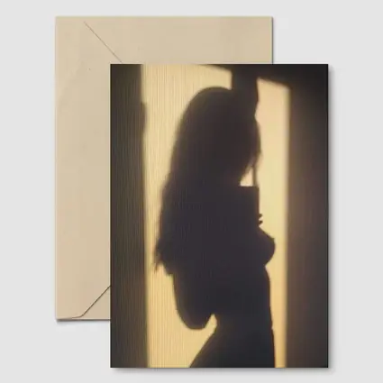 Woman Silhouette Shadow On Beige Wall